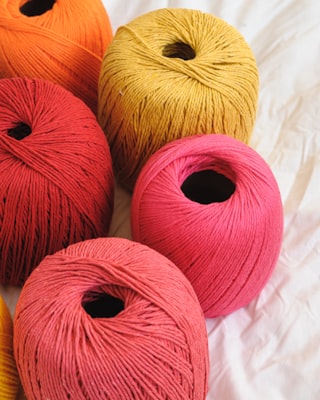 Photo by Giulia Bertelli on Unsplash — representative image for Knit One, Purl Two-gether with the Durham Purls