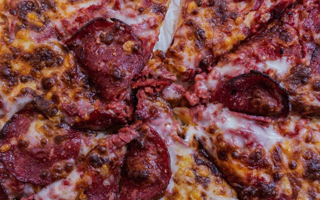 Photo by Foad Roshan on Unsplash — representative image for Domino's Pizza (Domino's)